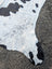 Hello#10 large cowhide rug in white and black with natural fur texture showcasing unique rustic charm