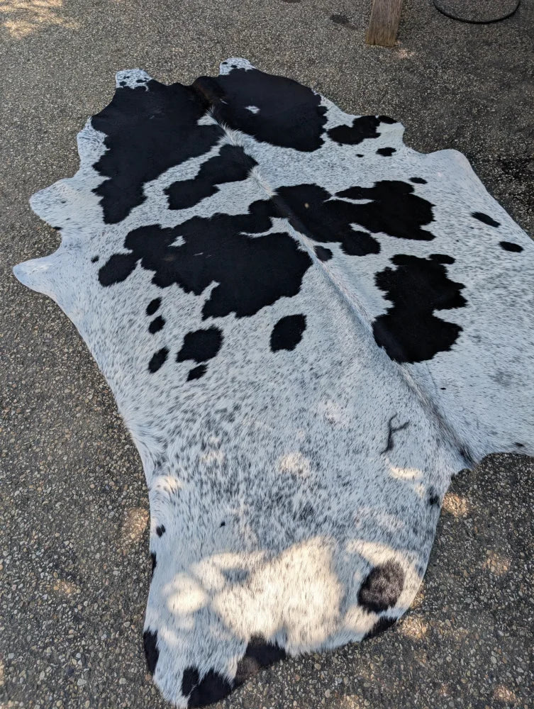 Hello10 92 x 735 large cowhide rug with black and white natural fur texture and unique rustic charm