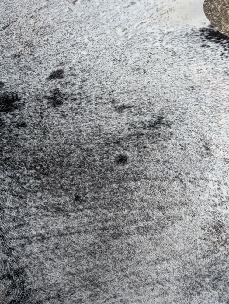 Hello11 large cowhide rug with gray and black speckled faux fur showcasing beautiful rugs and unique characteristics