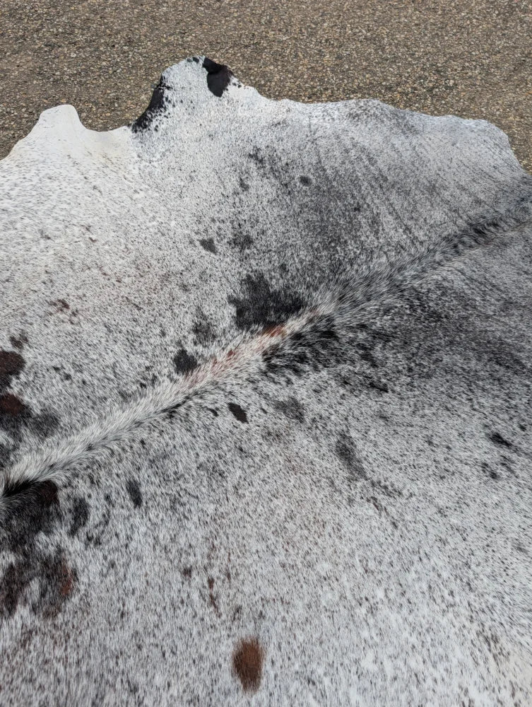 Hello11 large cowhide rug with gray and black speckled pattern and unique natural textured surface for beautiful rugs