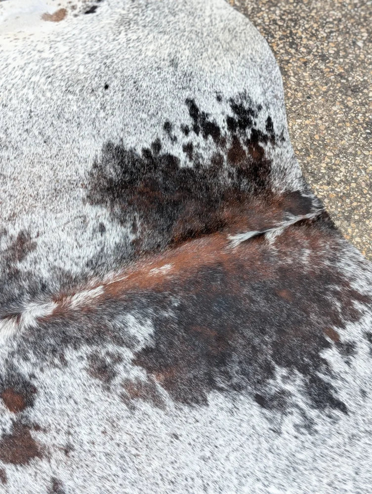 Hello11 87 x 72 large cowhide rug with beautiful black white and brown speckled patches showcasing unique characteristics