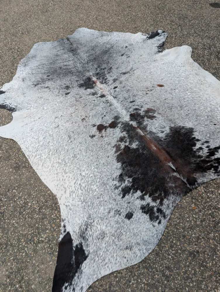 Hello11 large cowhide rug in white and black with natural speckles and unique characteristics for beautiful rugs