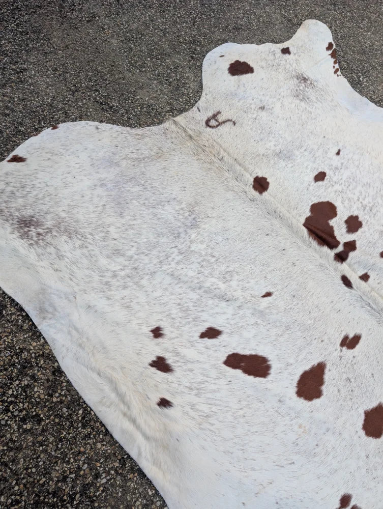 Large cowhide rug hello12 with white and brown spots featuring unique characteristics and beautiful rugs design