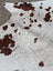 Hello12 large cowhide rug with brown and white spots and natural fur texture showcasing unique characteristics