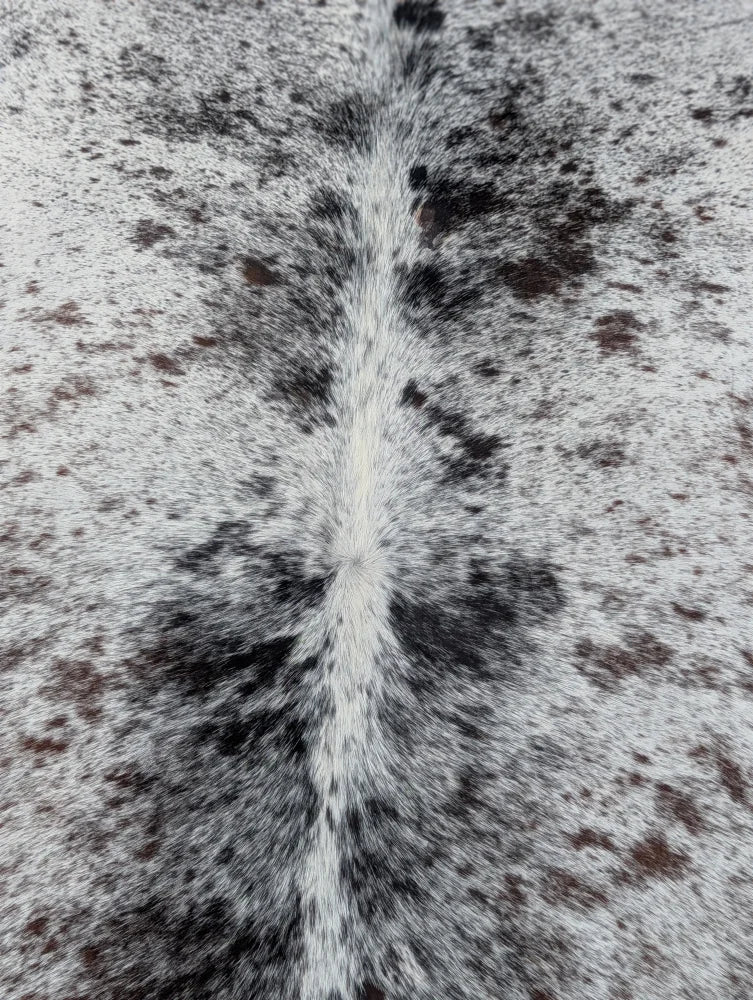 Hello13 extra large cowhide rug with white and black speckles and a central fur stripe perfect for beautiful rugs with unique characteristics