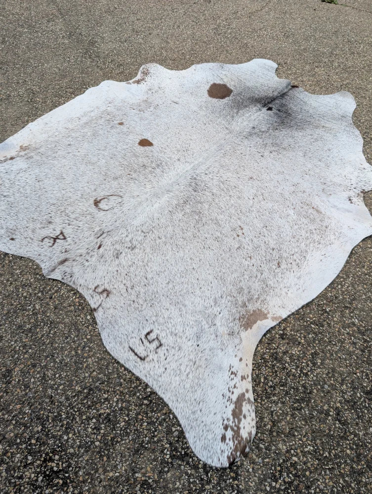 Hello14 89 x 79 extra large white and brown speckled cowhide rug with natural edges showcases unique characteristics