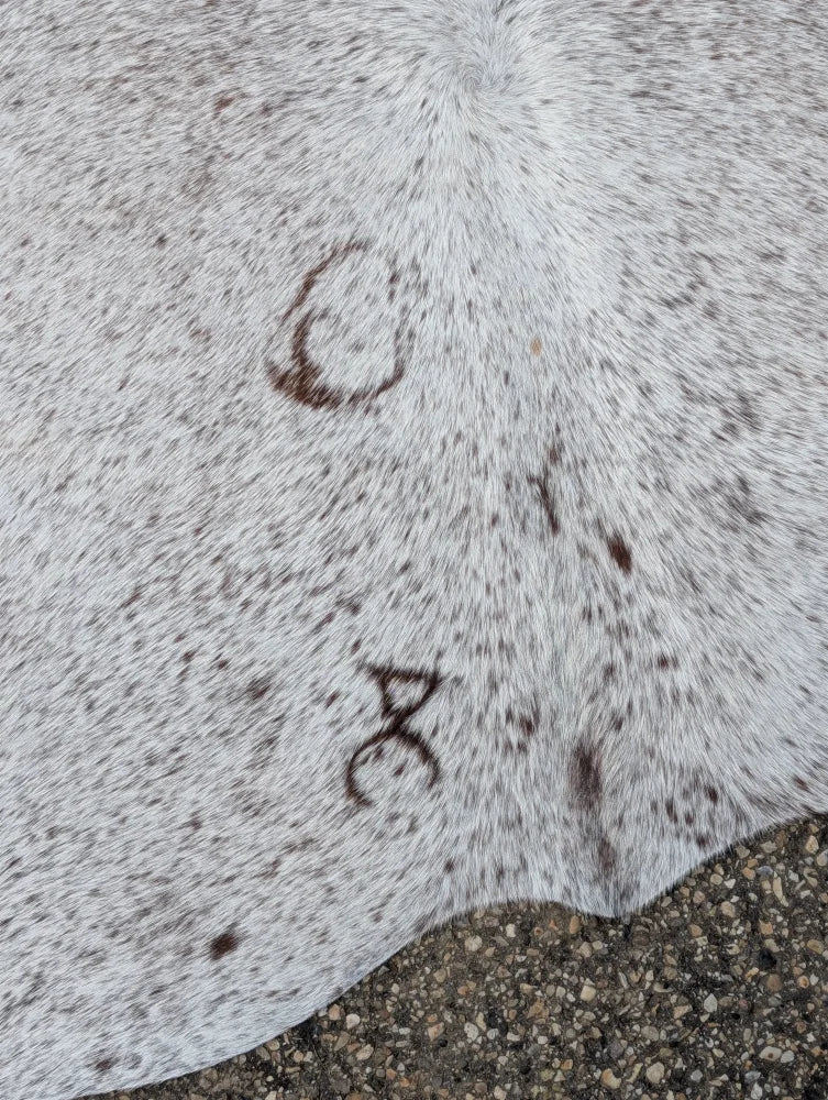 Hello14 large cowhide rug with white and gray speckles and dark brown markings perfect for beautiful rugs collection