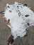 Hello 15 large cowhide rug with white base and brown patches showcasing unique characteristics and beautiful rugs style
