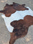 Hello2 large cowhide rug with brown and white natural fur texture showing unique characteristics and rustic charm