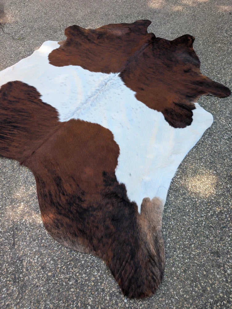 Hello#2 88 x 78 large cowhide rug with brown and white natural fur texture showcasing unique characteristics and rustic charm
