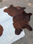 Hello2 large brown and white cowhide rug with natural fur texture showcasing unique characteristics and rustic charm