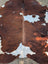 Hello3 large cowhide rug 88 x 78 with brown and white natural patches and unique characteristics for rustic charm