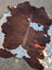 Hello#3 88 x 78 large cowhide rug with brown and white natural patches offering unique characteristics and rustic charm
