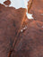 Hello3 large cowhide rug with brown and white natural fur texture showcasing unique characteristics and rustic charm