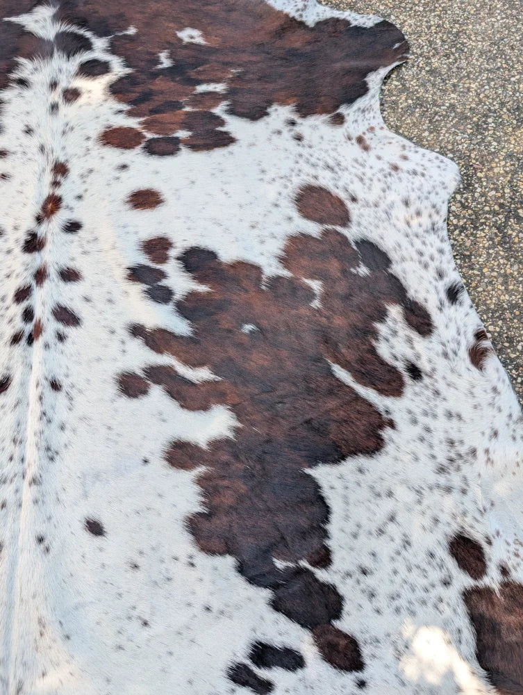 Hello#4 large cowhide rug in natural white and brown with unique spotted pattern and rustic charm