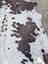 Hello#4 large cowhide rug in natural white and brown with unique spotted pattern and rustic charm