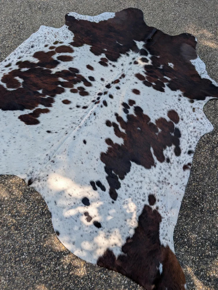 Hello4 87 x 79 large cowhide rug with brown and white patches showing unique characteristics and rustic charm