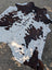Hello4 87 x 79 large cowhide rug with brown and white patches showing unique characteristics and rustic charm