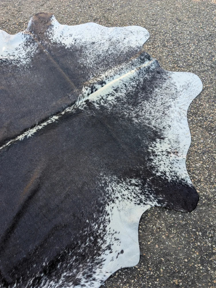 Hello9 large black and white cowhide rug with unique natural edges adds rustic charm to any room