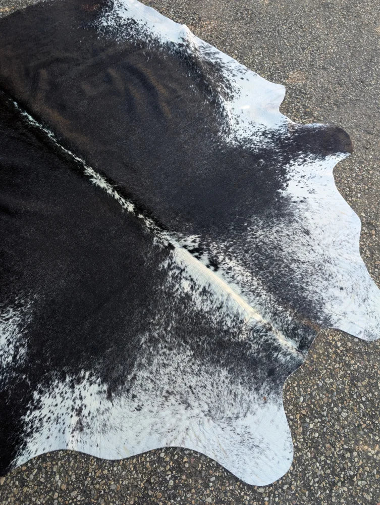Large hello9 83 x 72 black and white cowhide rug with unique natural irregular edges and rustic charm