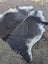 Hello#9 large black and white cowhide rug with unique characteristics and rustic charm featuring a natural edge