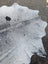 Natural white and black large cowhide rug hellow7 with textured irregular edge and unique rustic charm