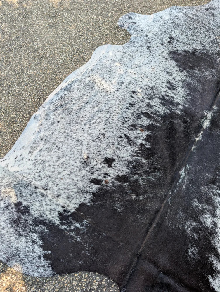Hellow8 large cowhide rug with black and white natural irregular patches showcasing unique characteristics and rustic charm
