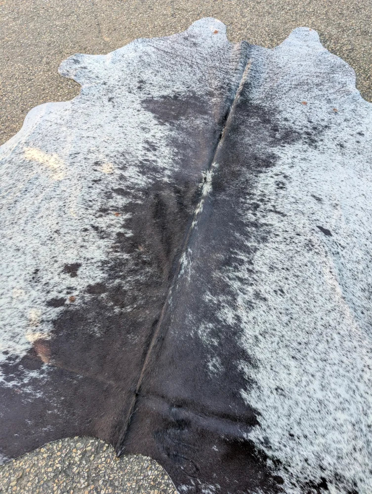 Hellow#8 large cowhide rug in black and white with natural irregular edges adds rustic charm and unique characteristics