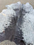 Hellow#8 large cowhide rug in black and white with natural irregular edges adds rustic charm and unique characteristics