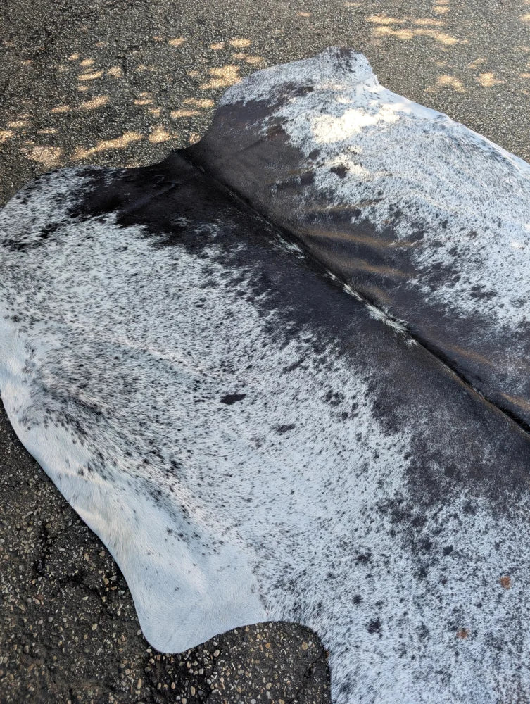 Hellow#8 large black and white speckled cowhide rug with unique characteristics and rustic charm natural texture