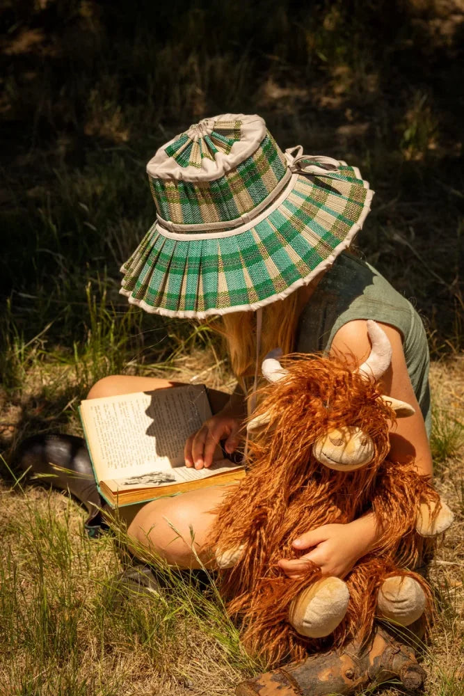 Green and white plaid sun hat with pleated brim and bow from henry the highland cow collection