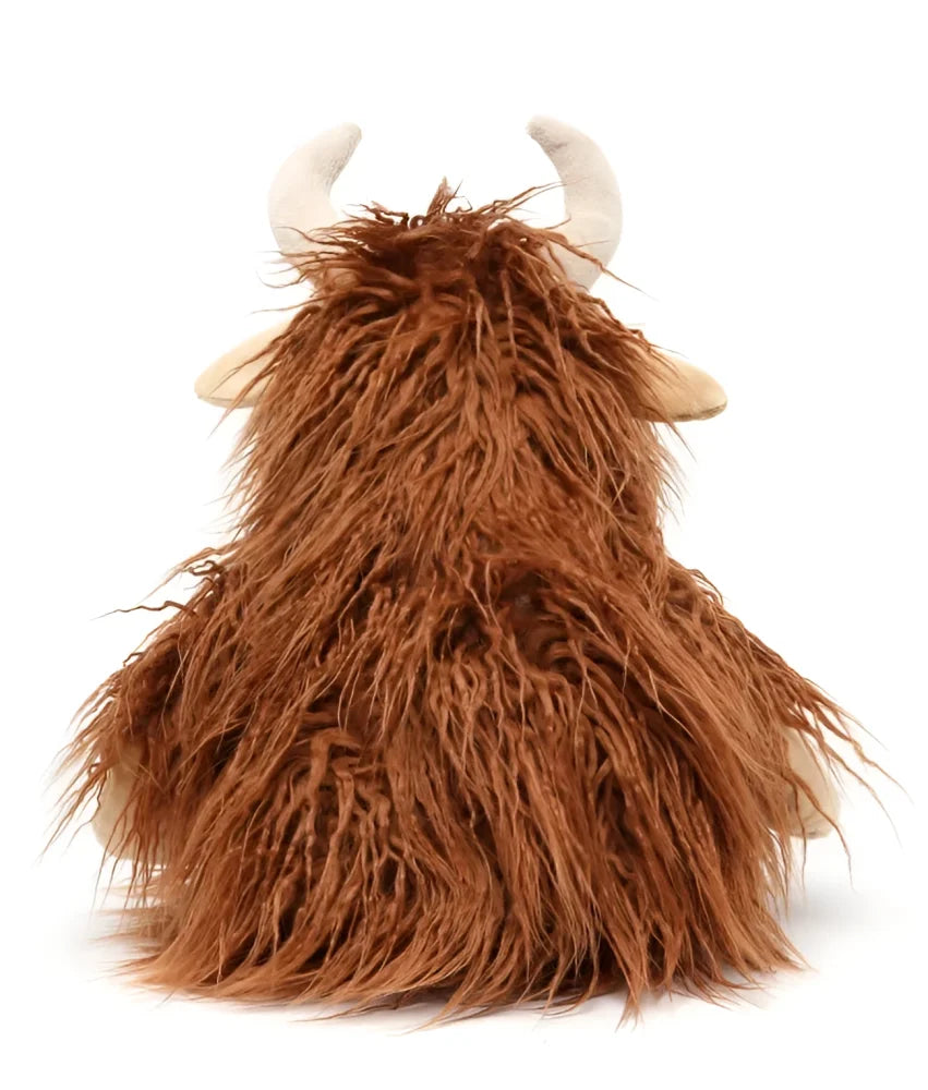 A plush henry the highland cow toy with long shaggy brown fur and light beige horns perfect for cuddling
