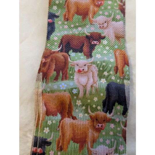 Highland cow tie by Good Luck Socks on green floral background