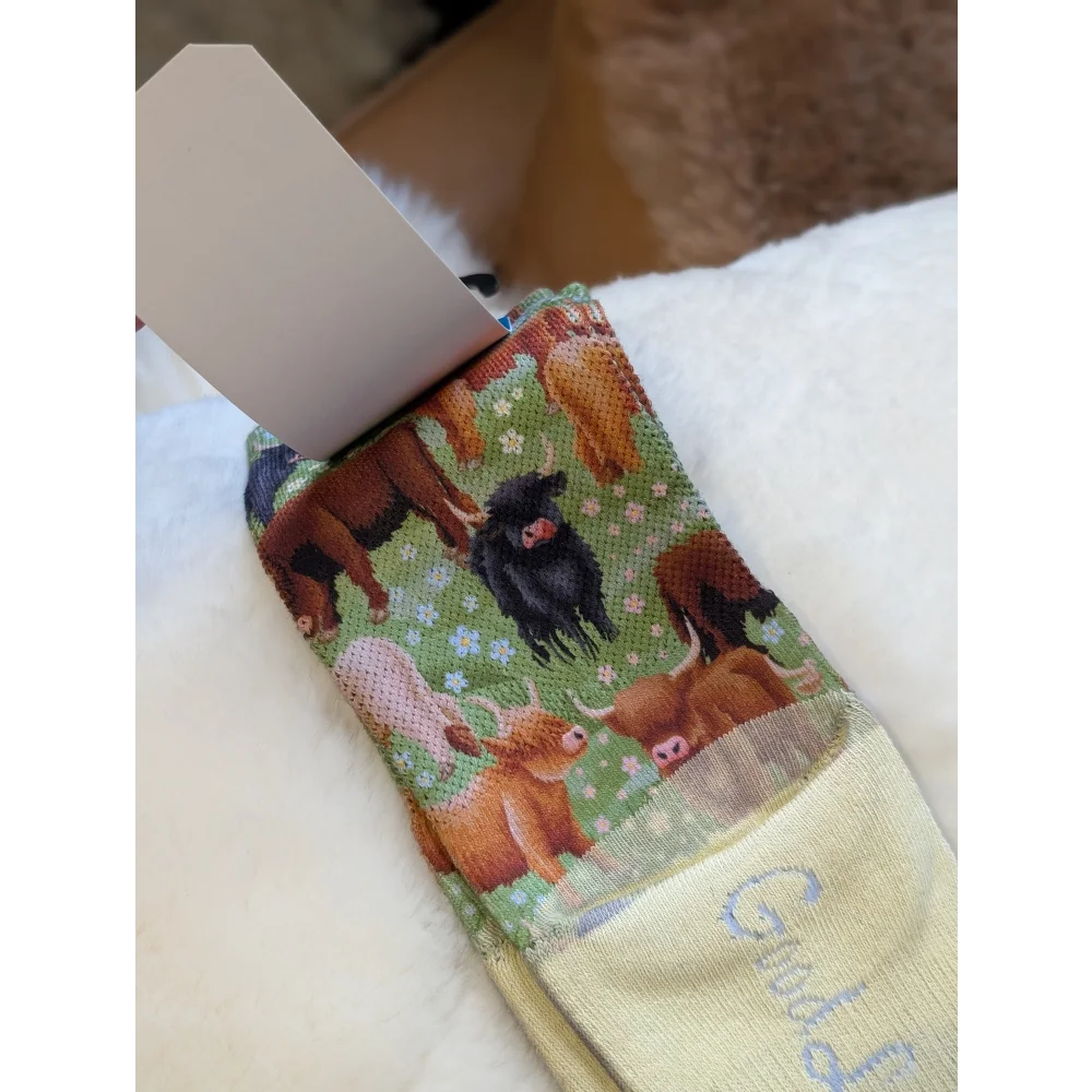 Highland Cow good luck socks napkin with green brown fabric and good text