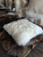 Comfy sheepskin pet bed with Canadian sheep’s wool and plush white fur throw