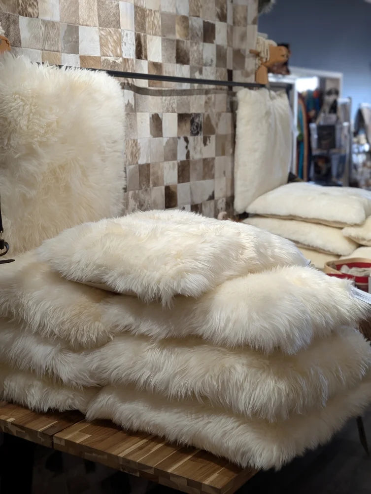 Luxurious white faux fur throw on Comfy Sheepskin Pet Bed with Canadian sheep’s wool