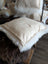 Cream-colored plush sheepskin pillow stuffed with Canadian sheep’s wool