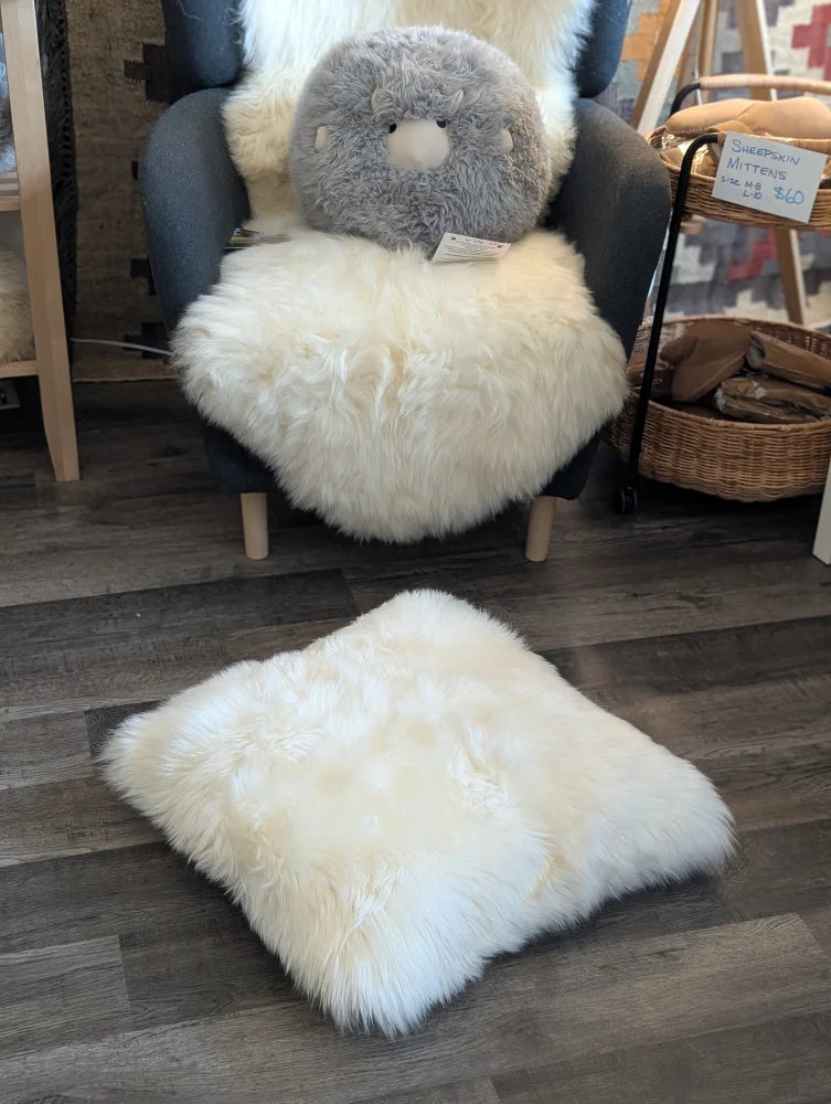 Fluffy white merino sheepskin pet bed stuffed with Canadian sheep’s wool