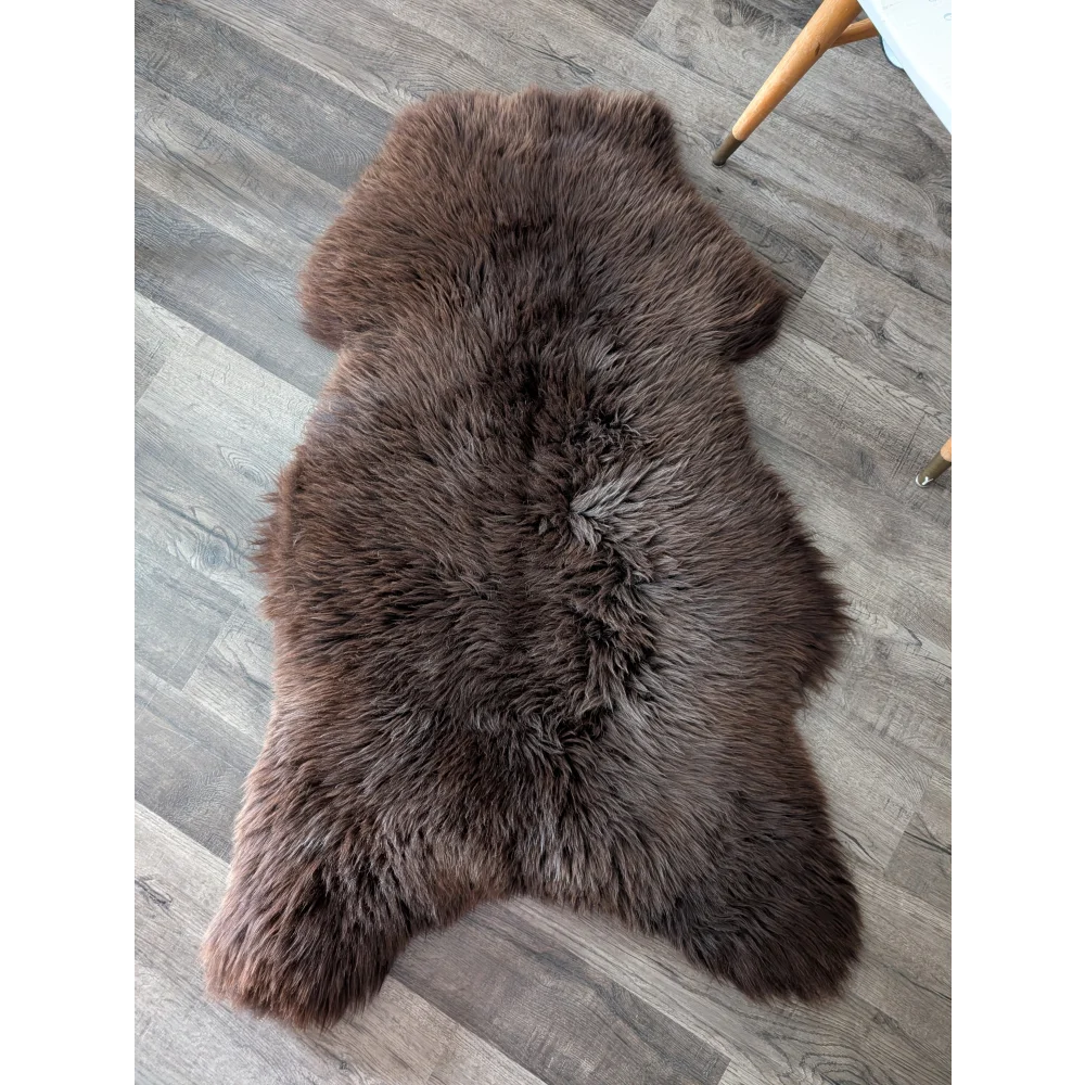A gorgeous extra large dark brown british sheepskin rug by angus oliver with fluffy texture perfect for canada homes