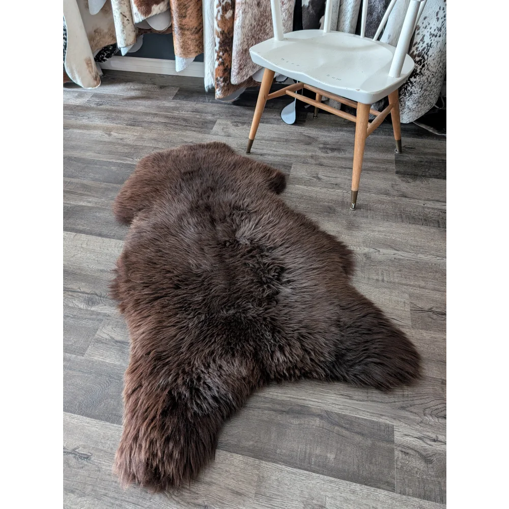 A gorgeous extra large british sheepskin rug in dark brown with soft dense fur by angus oliver canada for cozy spaces