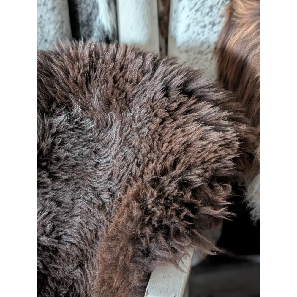 A plush thick brown angus oliver british sheepskin rug with soft curly texture perfect for cozy canada homes