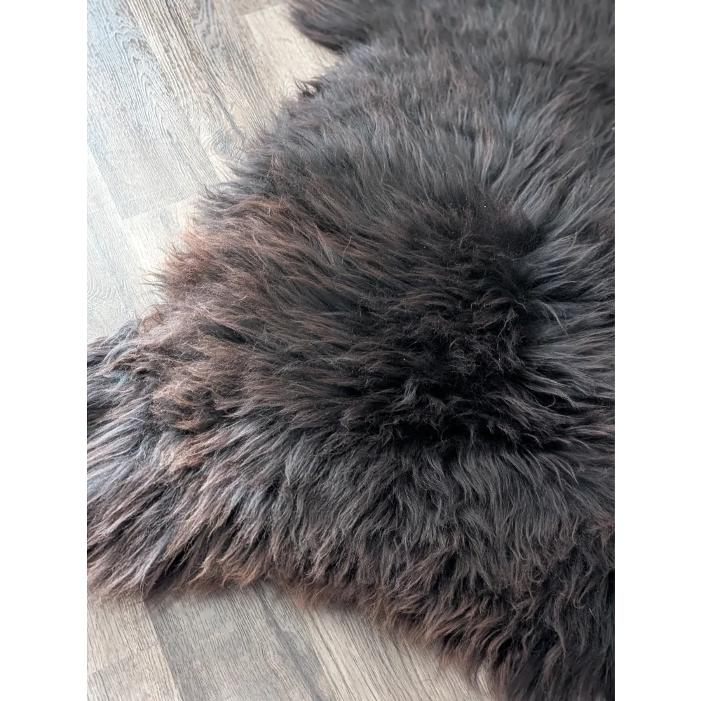 A gorgeous extra large dark gray british sheepskin rug by angus oliver canada with soft natural fur variations