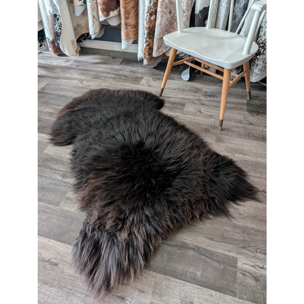 A gorgeous extra large dark charcoal british sheepskin rug with long dense fur by angus oliver canada sheepskin rugs