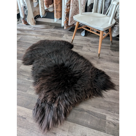 A gorgeous extra large dark charcoal british sheepskin rug with long dense fur by angus oliver canada sheepskin rugs