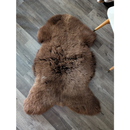 A plush brown angus oliver sheepskin rug from canada with soft fluffy texture perfect for cozy home decor