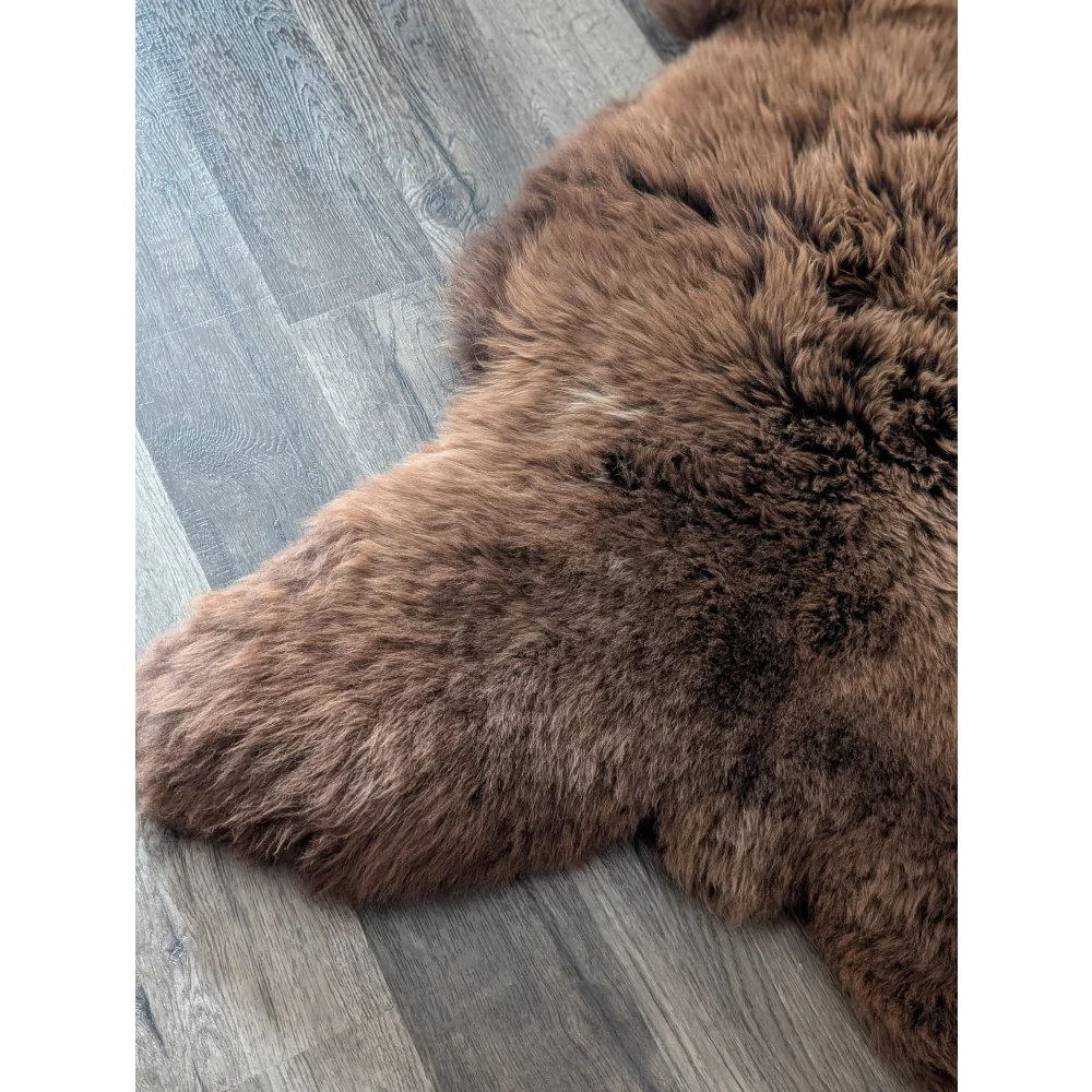 A gorgeous extra large natural brown angus oliver sheepskin rug with soft fluffy texture perfect for canada homes