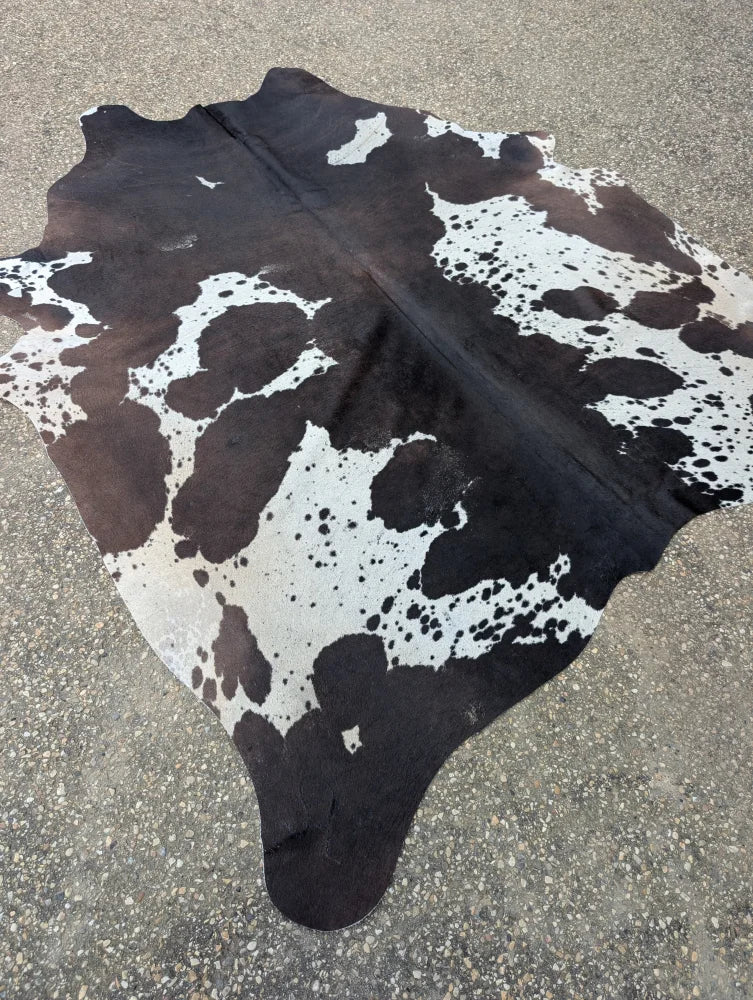 Hum12 92 x 80 extra large black and white cowhide rug with natural irregular patches showcasing unique characteristics