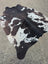 Hum12 92 x 80 extra large black and white cowhide rug with natural irregular patches showcasing unique characteristics