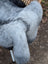 A plush gray and black faux fur stuffed animal with soft fluffy texture inspired by long wool icelandic sheepskin