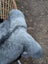 A plush gray fuzzy stuffed animal with soft long wool icelandic sheepskin fur and rounded ears